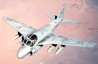 A US Navy A-6E Intruder from attack squadron VA-75 “Sunday Punchers” flies over the desert Operation Desert Storm in 1991. (US Navy)